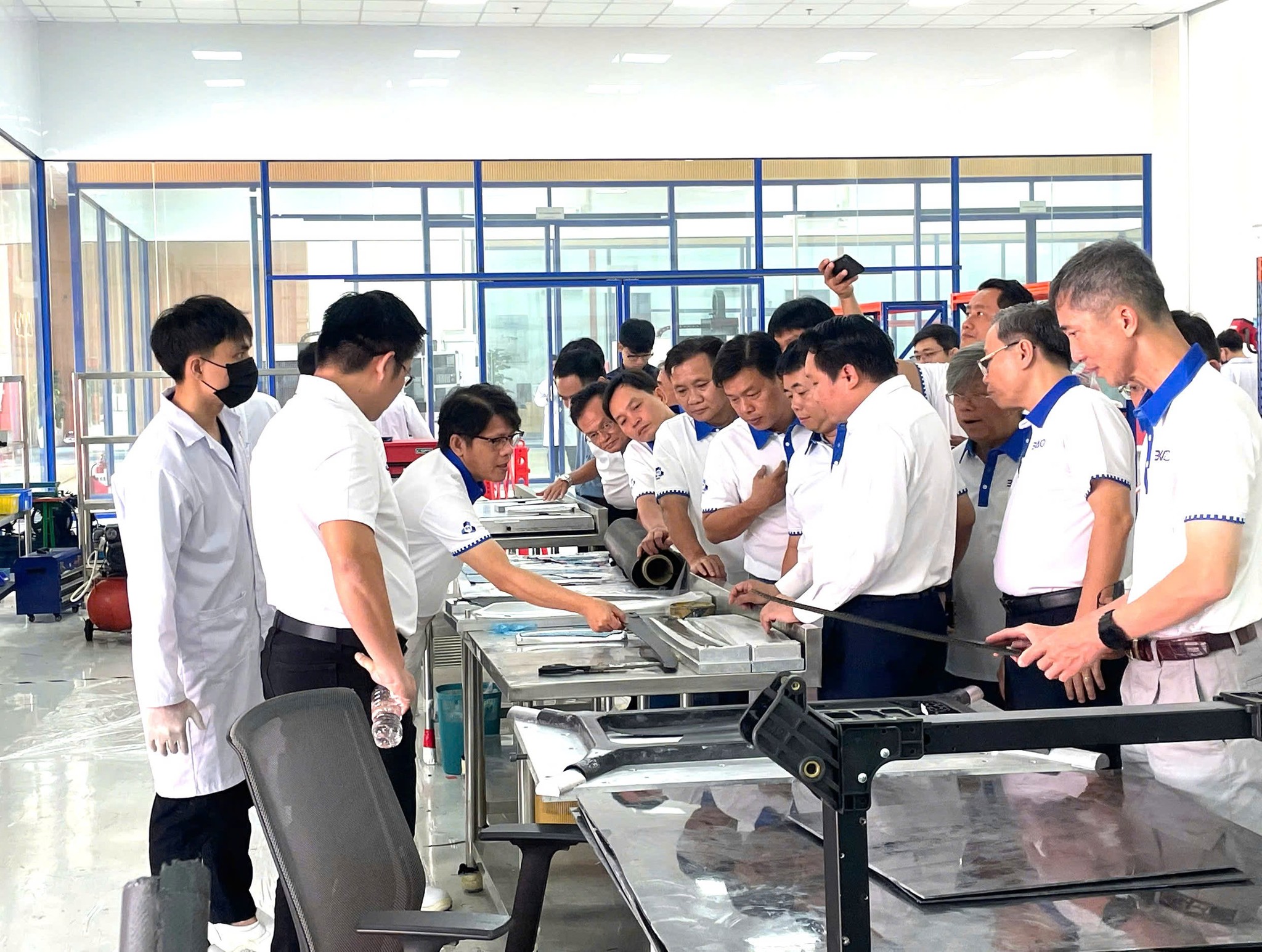 Engineers and visitors at a CT UAV technical facility